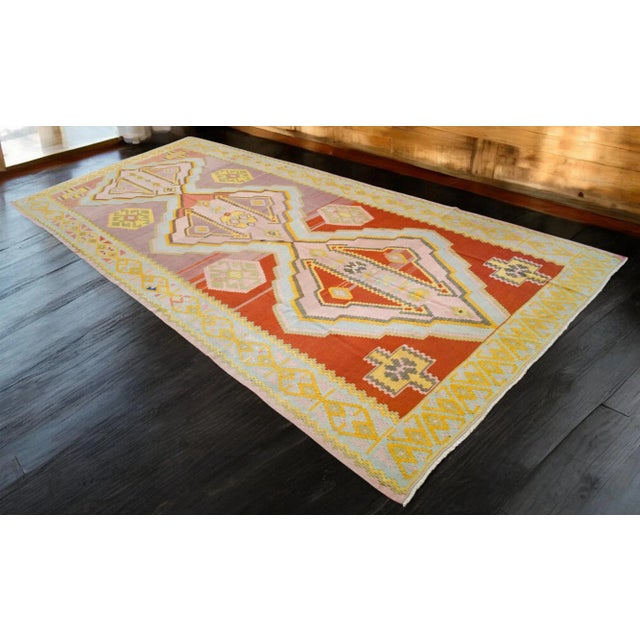 Bring a touch of vintage charm to your living room with this large handmade Turkish Kilim rug. Measuring approximately...