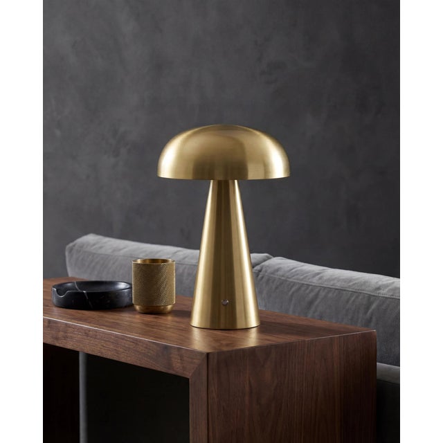 Illuminate your space with the chic and portable Umbra accent table lamp, a beacon of minimalist modern style. Standing at...