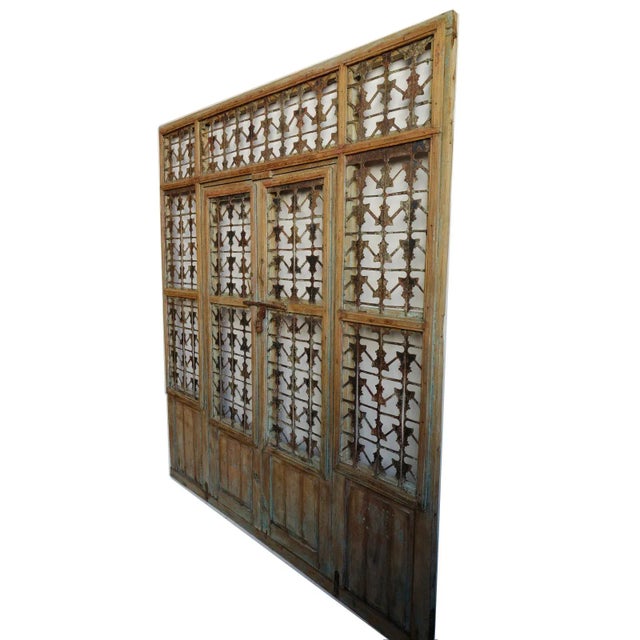 Vintage wood and iron screen doors from India. Beautiful detailed iron work screen panels with characteristic signs of age...