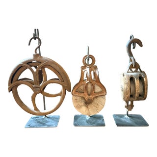 Collection of Three Antique Industrial Wood & Cast Iron Pulleys on Custom Display Stands For Sale