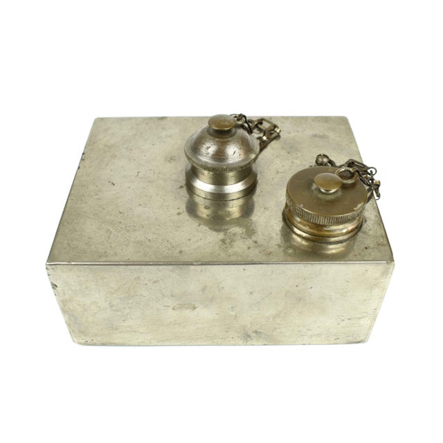 This image shows a vintage rectangular oil lamp with a sleek, mid-century modern design. The lamp appears to be made of...