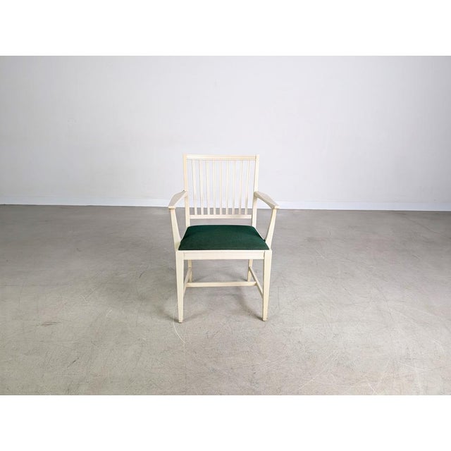 Beautiful Svante Skogh vintage armchair from the 1960s. The chair is upholstered in a green velvet fabric, while the wood...