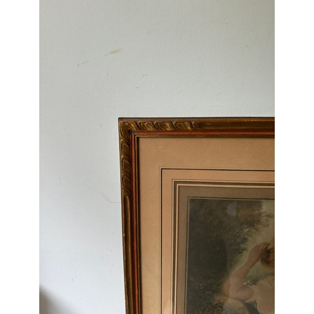 Up for consideration is a beautiful framed and signed print of a woman in the garden. This would look lovely in your home...