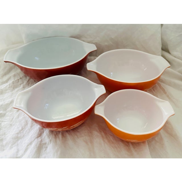 Vintage Set of 4 Pyrex "Autumn Harvest" Cinderella Mixing bowls. Wheat motif on all bowls in Orange/Rust Background. Great...