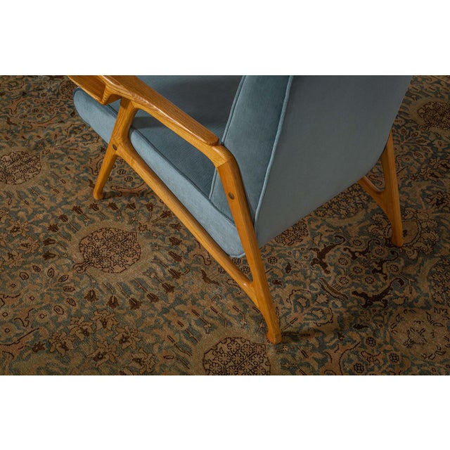 A late 19th century Persian Tabriz antique carpet, the abrashed sage field with horizontally arranged palmettes, shrubbery...