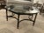 1970s hexagon black metal and glass coffee table. This chic accent piece pairs the coolness of painted black metal with...