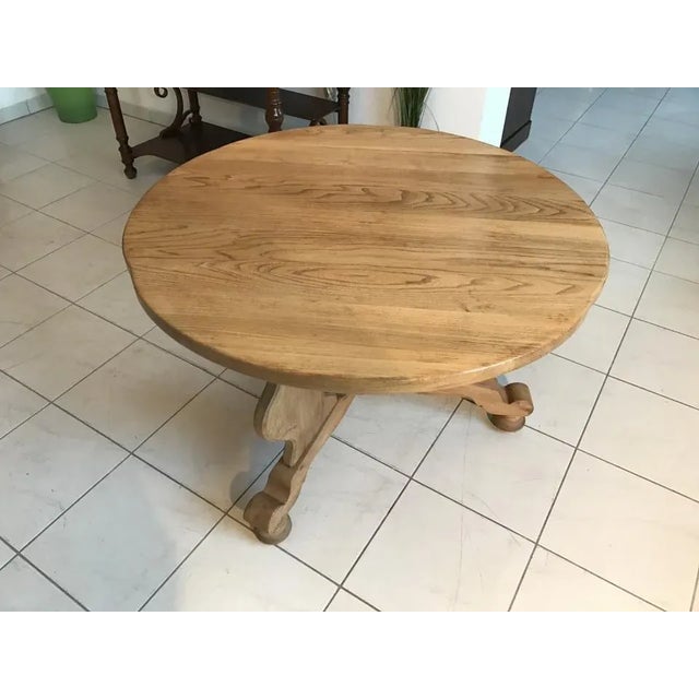 Here is an old solid farm table made of solid oak. This table is stable, stands mighty on 3 feet which are connected by a...
