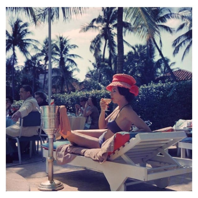 Leisure And Fashion 1961 A woman watching a poolside fashion show at the Colony Hotel, Palm Beach, Florida, 1961. Photo by...