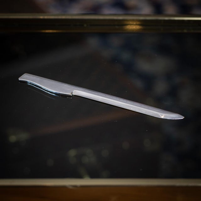 Vintage 20th century french solid silver hermès letter opener, crafted in a sleek, minimalist design. The piece features a...