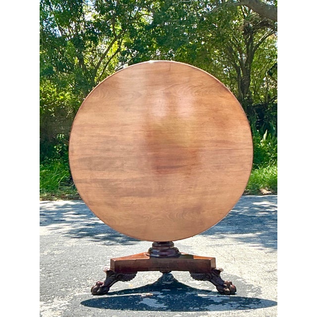 Discover the enduring elegance of the past with this magnificent Vintage Regency Tilt Top Table, a true gem for any...