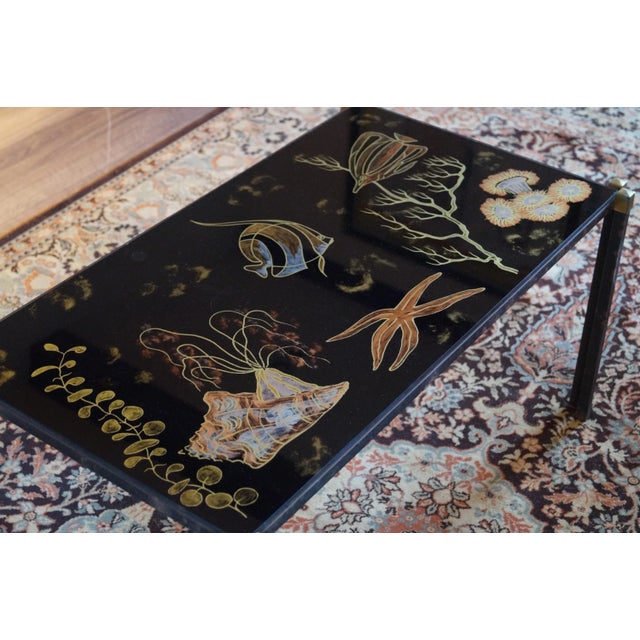 Lovely mediterranean feel. Extremely decorative and rare side table. Hand painted so one of a kind. Glass top. Metal and...