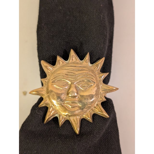 8 Vintage Brass Sun Face Napkin Rings. These 1970's napkin rings feature original patina and a whimsical celestial motif....