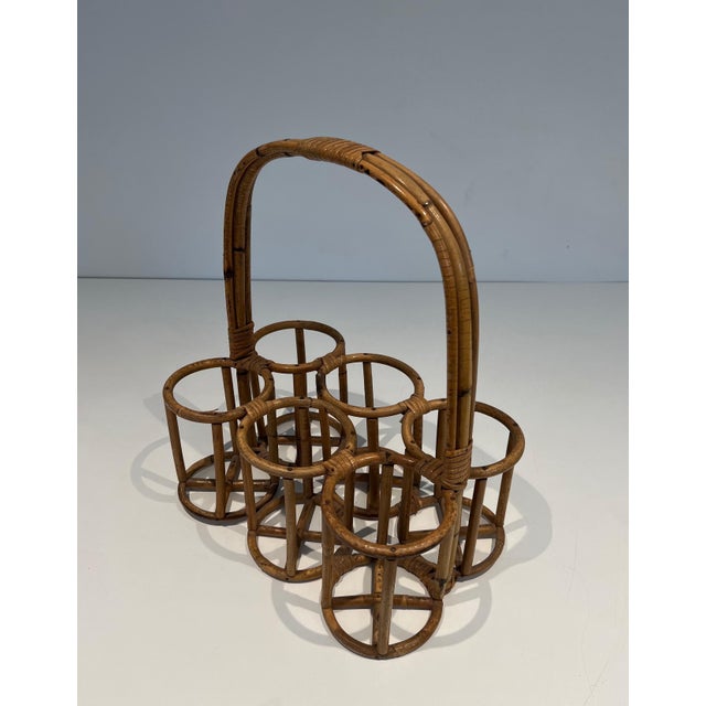 This beautiful and rare rattan bottle holder is a French work. Circa 1950