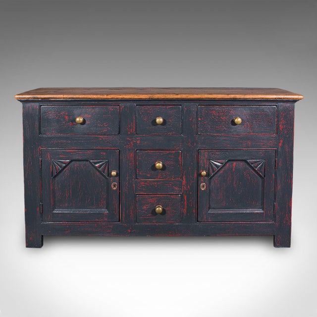 This is a vintage dresser base. An English, painted pine lounge or kitchen sideboard, dating to the mid 20th century,...