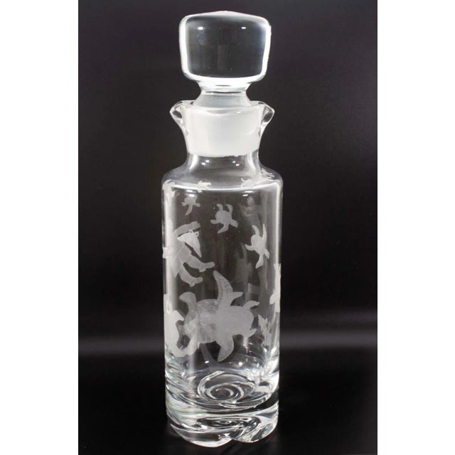 A lovely contemporary studio clear art glass decanter with an etched turtle design by Ronald Pennell. Signed and dated...