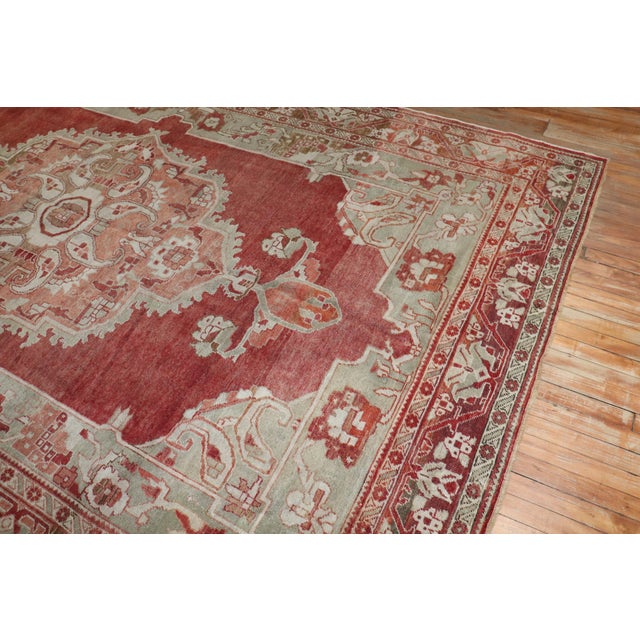An antique Turkish rug from the early 20th century in a room-size format. Measures: 7'7'' x 11'6''.
