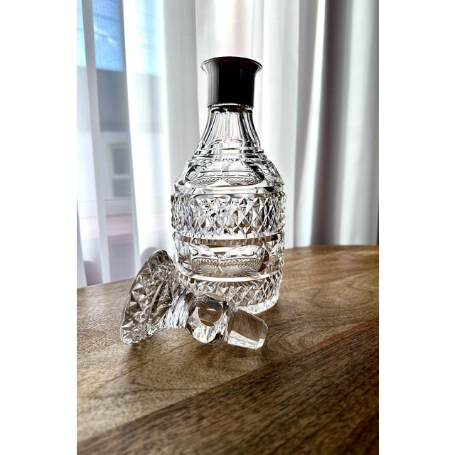 This rare and beautifully preserved set of five cut crystal decanters is a superb example of anglo-irish glassmaking,...