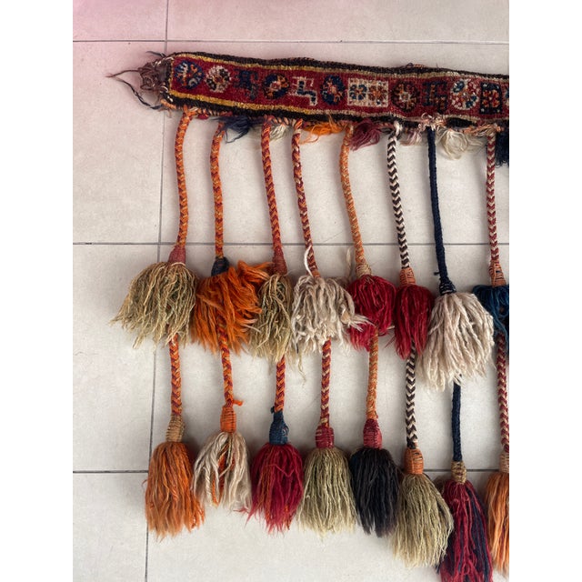 A Qashqai camel trapping is a traditional, handwoven or embroidered textile used to decorate ceremonial and bridal camels...