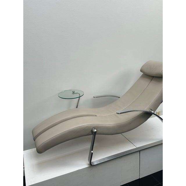 A sculptural contemporary chaise lounger by Limitless, designed with a fluid, ergonomic silhouette and a striking...