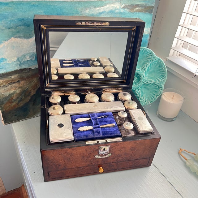 An exceptional and highly complete Victorian burr walnut traveling vanity and dressing case, retailed by the prestigious...