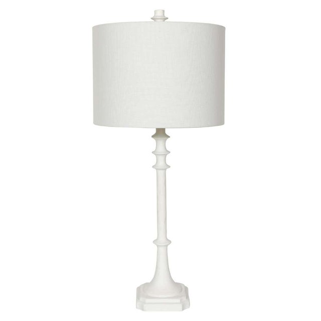 An elegant pair of tall table lamps featuring a sculptural column form finished in crisp white gesso. The slender,...