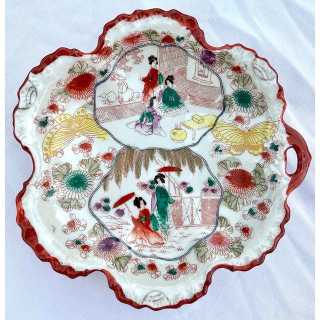 Offered is a beautiful set of twenty-six (26) hand painted plates, bowls, and a moriage tray made in Japan circa 1920....