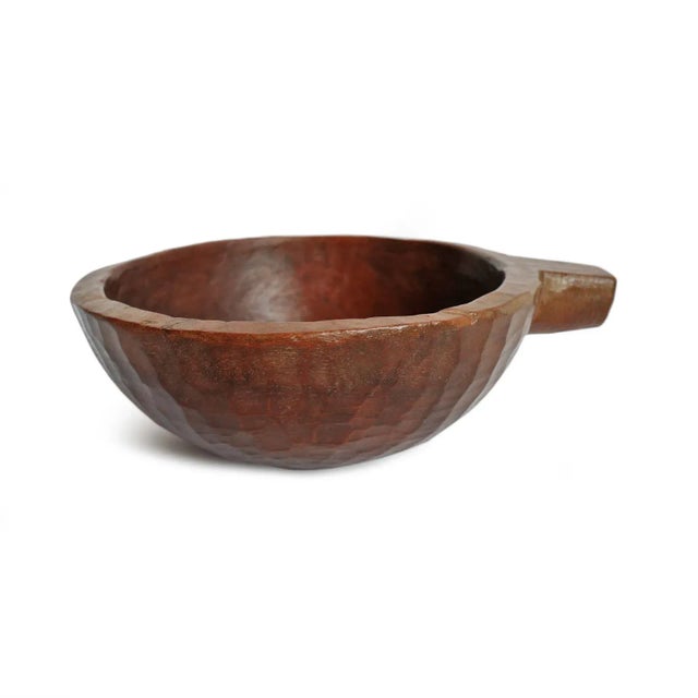 Small vintage handmade teak wood bowl with handle from Nepal. Warm chestnut finish and beautiful signs of age and use.