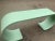 Mid century style waterfall console done in a sea foam green. Console is made of solid alder. Console has great lines and...