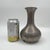 Vintage Pewter Bulb Vase by Poole. This piece features a classic style with an elongated urn or gourd shape and a stepped...