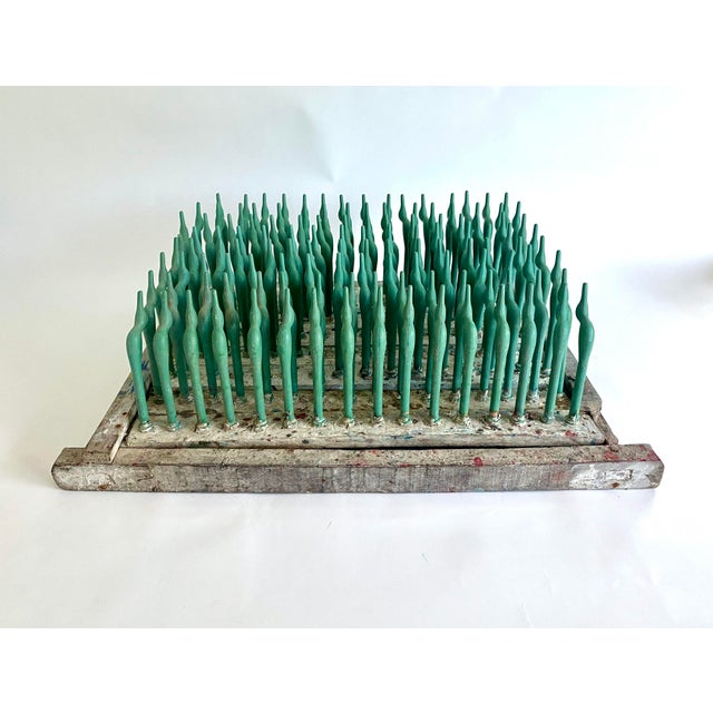 A unique piece of industrial salvage with green bird shaped spindles, this sculptural vintage balloon mold with plastic...