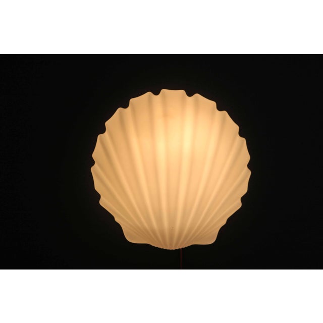 Shell Wall Lamp in Opal Glass from Glashütte Limburg, 1970s, in Very Good conditions. Designed 1970 to 1979 This piece has...