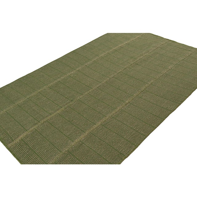 Handwoven in wool, a 6x9 Kilim in Green with Beige accents, from a bold new line of contemporary flatweaves, ‘Rez Kilim’,...