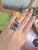 We offer free 2-day shipping! This vintage ring features a rectangular lapis lazuli carving set within an architectural...