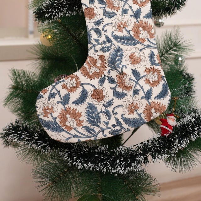 Celebrate the season with this handmade thick cotton stocking in crisp white with blue and brown accents, featuring the...