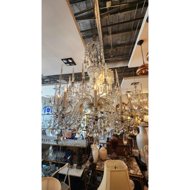 This listing features a large Baccarat crystal chandelier that houses 10 lights. The craftsmanship on this chandelier is...