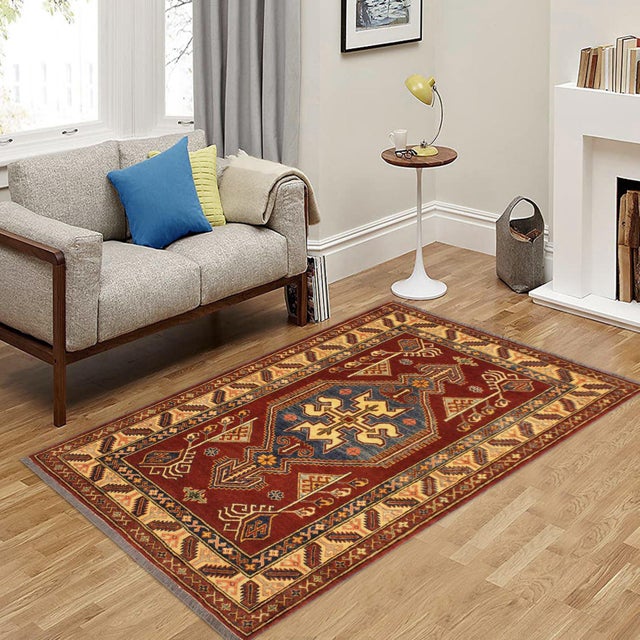 Enhance your home with this exquisite hand-knotted Super Kazak rug, crafted from fine hand-spun wool and dyed with all-...