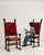 Here is a pair of dining chairs, its dark wood turned frame, red upholstered seats the first thing to catch the eye....