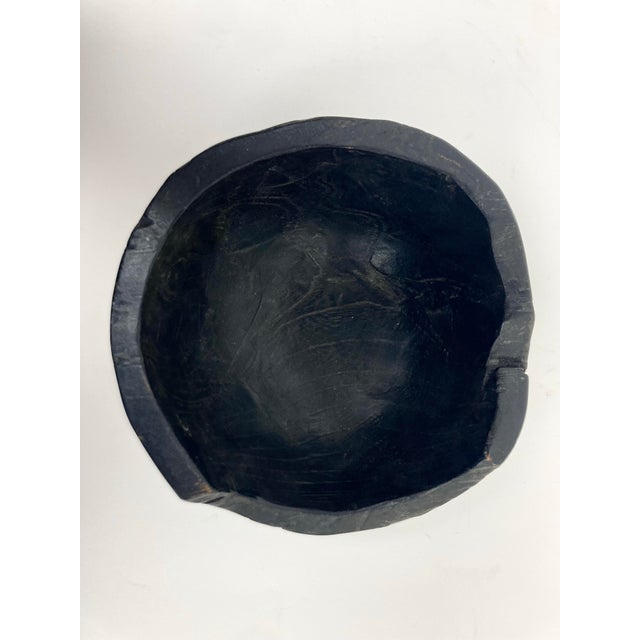 A Charred Wood Bowl with good weight, thickness and fine Satin polish. The Bowl with intentional top and rim losses and...