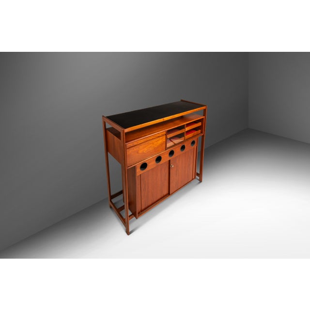 Introducing a rare Danish-made dry bar designed by the incomparable Knud Bent for Dyrlund. This sculptural and highly...