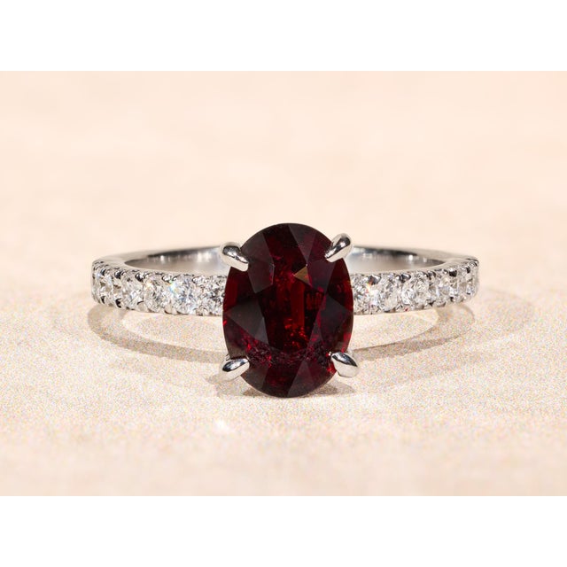 The Camarillo: 2.03 Carat Natural No Heat Deep Red Ruby Engagement Ring. The ring features a central 2.03 carat oval...