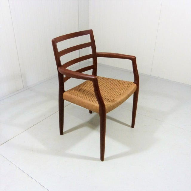 Desk / arm chair model 68 with arm rests by Niels Otto Møller for J.L. Moller, Denmark. Solid teak frame, braided wicker...