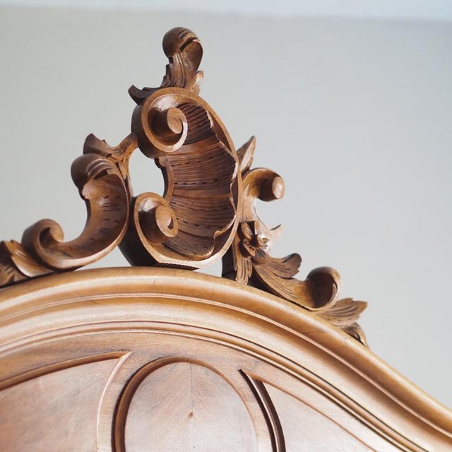 Two-door French mirrored wardrobe (armoire à glace) in the Louis XV style, made around 1900. The design is clearly...
