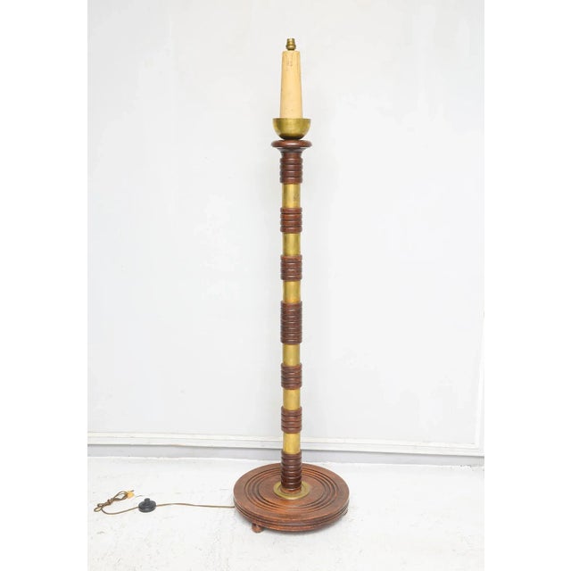 Sculptural French Mid-Century floor lamp with brass rings. Diameter of the Base is 16"