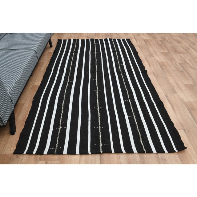 Vintage Turkish Hand-Knotted vintage rug is a semi-antique vintage area rug. The '70s Eastern region of Turkey's unique...