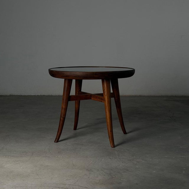 A refined raised coffee table attributed to Mario Quarti, Italy, 1940s — a piece that quietly embodies the warmth and...