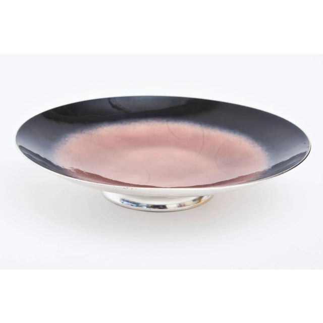 This gorgeous vintage artist signed bowl from the 1960s is enamel black with rose toned center with swirls of sterling...