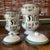 Two lidded ceramic European apothecary jars with green, black, and tan paint. Good condition. Larger: 13.5” , approx. 11”...