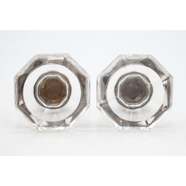 Vintage cabinet or drawer knobs made of clear glass with an octagon shape and brass shanks. Mounting screws are included....