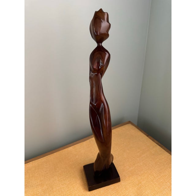 Striking vintage mid-century modern figurative sculpture. Standing at an impressive 18.25 inches tall, this piece depicts...