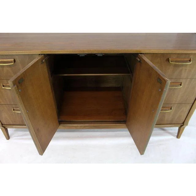 Mid-century modern credenza with Horn tone finish. Nice solid brass pulls. Made in the 1970s.